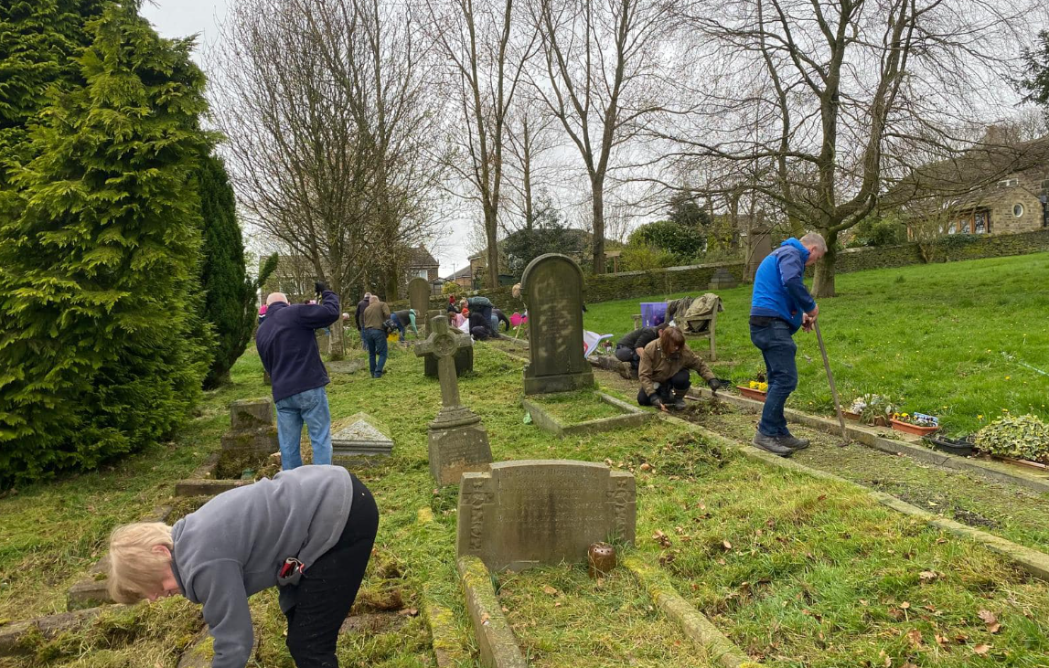 Local volunteers clearing and tending graves at St Nicholas.